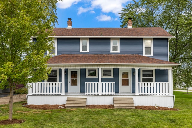 view of front of property with a porch and a front yard