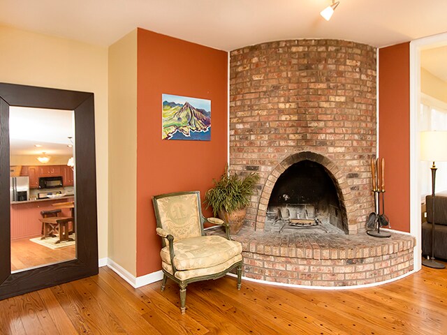 living area featuring a fireplace and light wood-type flooring