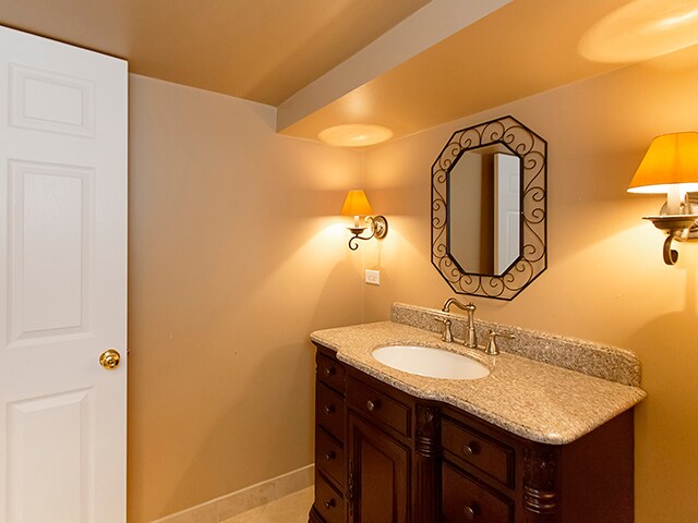 bathroom with vanity and tile patterned floors