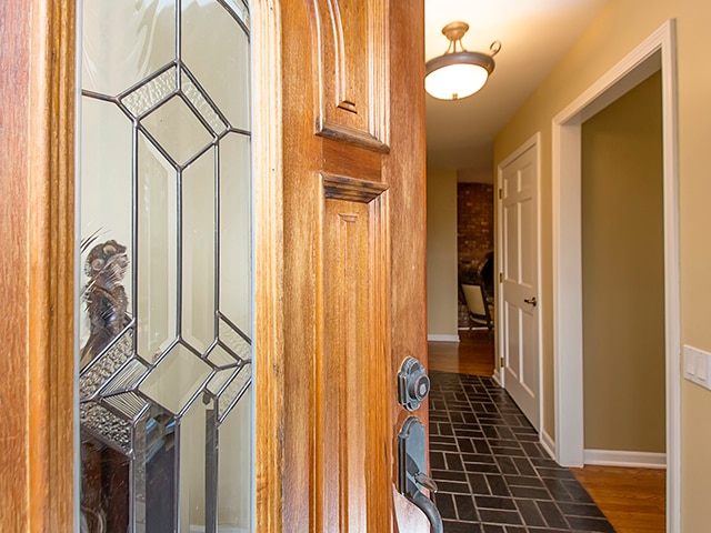 corridor featuring dark hardwood / wood-style flooring