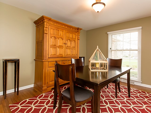 dining area with dark hardwood / wood-style floors