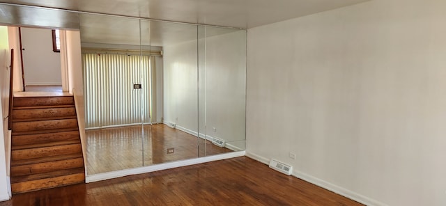 empty room featuring dark hardwood / wood-style floors