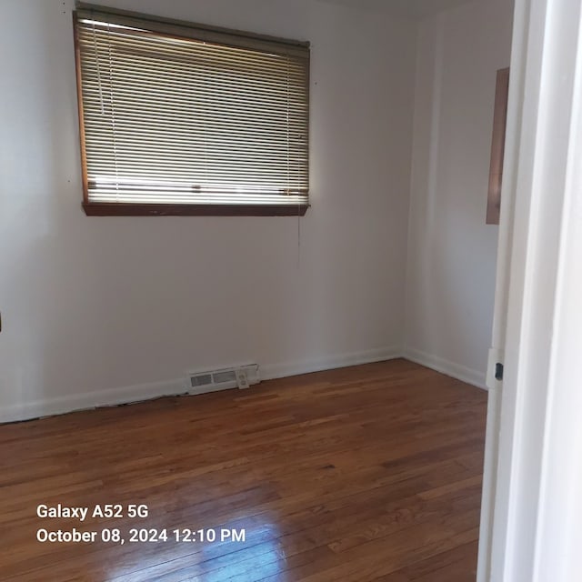 empty room featuring hardwood / wood-style flooring