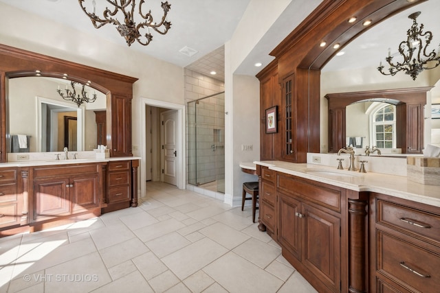 bathroom featuring vanity, tile patterned floors, and an enclosed shower