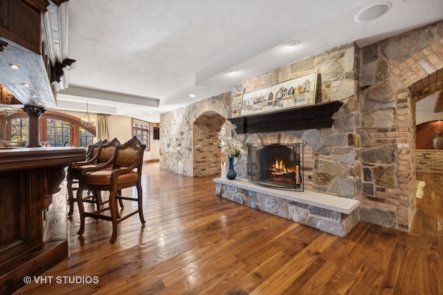 interior space with a fireplace and hardwood / wood-style floors