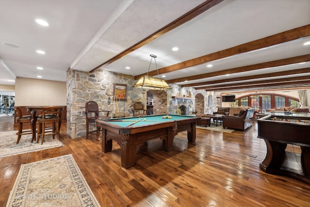 playroom with hardwood / wood-style floors, a fireplace, beamed ceiling, and billiards