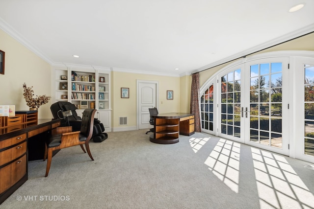 carpeted office featuring crown molding and french doors