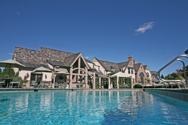 view of pool featuring a water slide