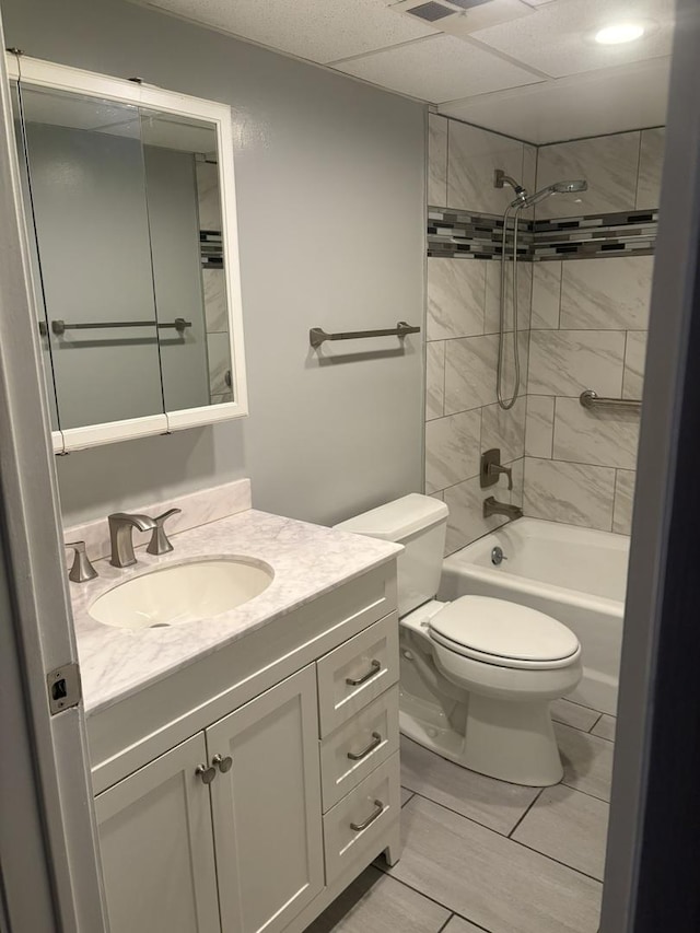 full bathroom with vanity, toilet, and tiled shower / bath