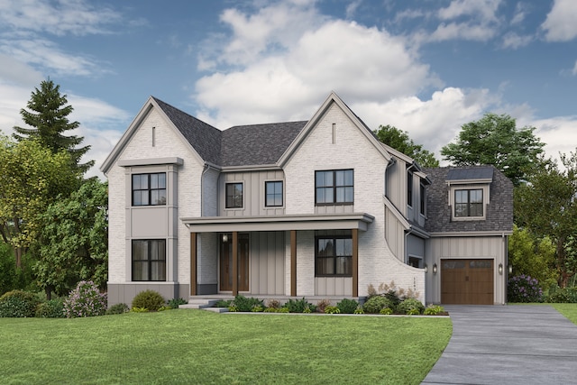 view of front of house with a garage and a front yard