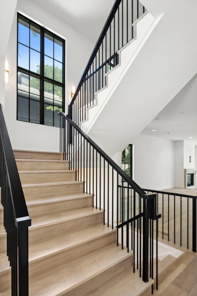 staircase with wood-type flooring