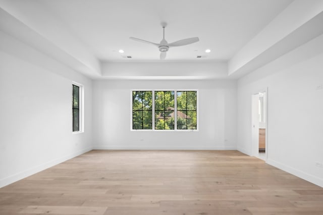 spare room featuring light wood-type flooring and ceiling fan