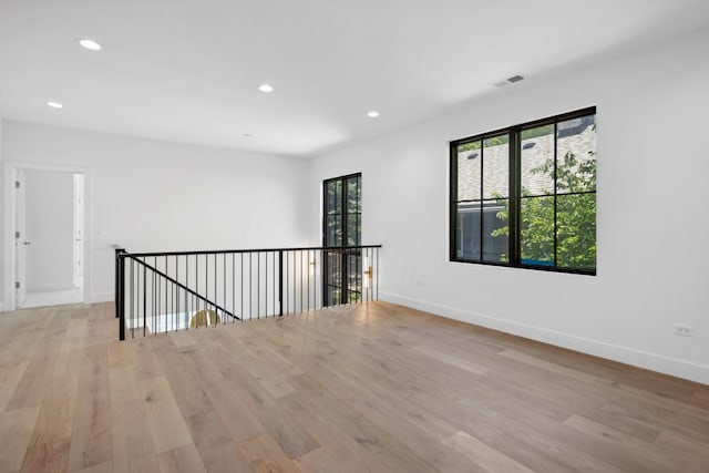 unfurnished room featuring light wood-type flooring