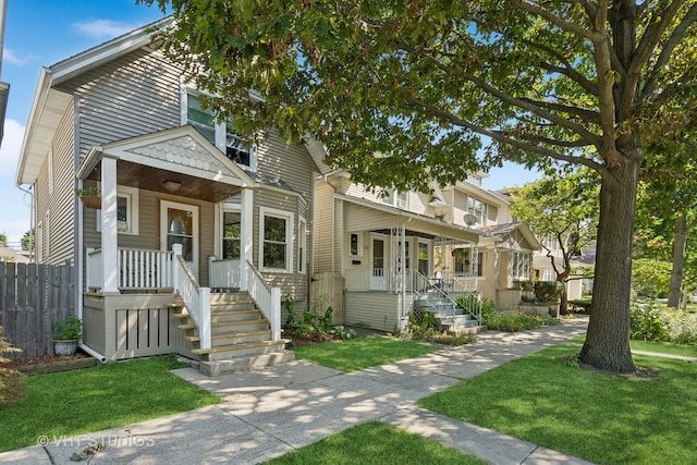 view of front of property featuring a front yard and a porch