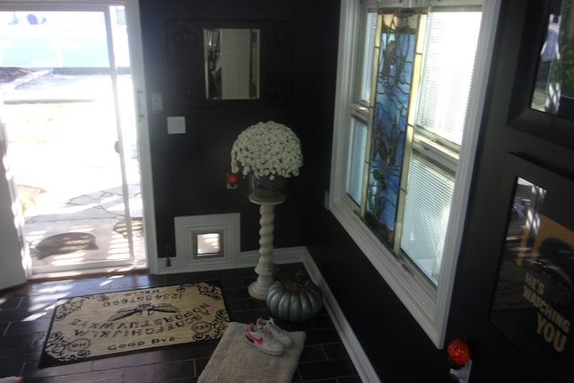 entrance foyer with tile patterned floors and a wealth of natural light