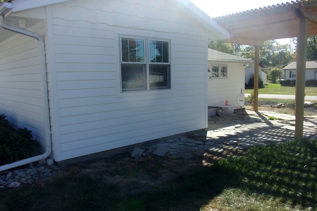 view of side of home with a patio