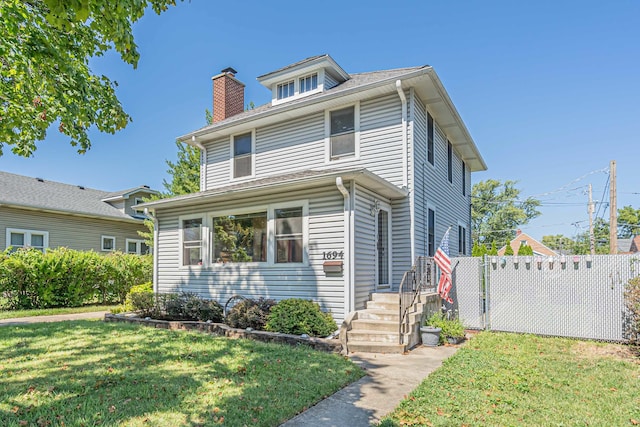 front facade with a front yard