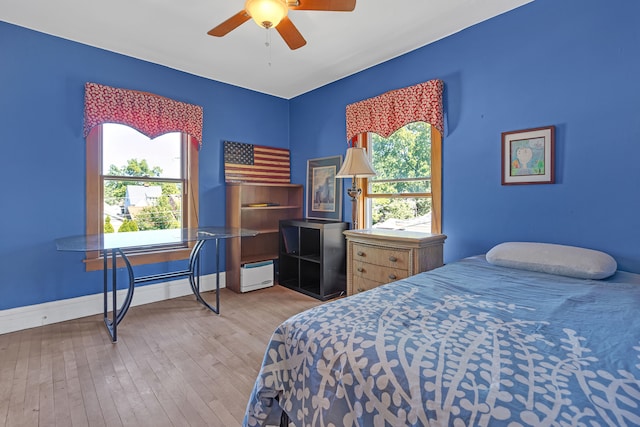 bedroom featuring ceiling fan and hardwood / wood-style flooring