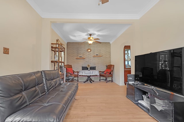 living room with ceiling fan, light hardwood / wood-style flooring, and ornamental molding