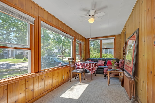 sunroom featuring ceiling fan