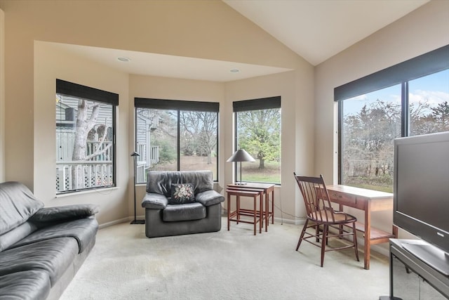 sunroom featuring lofted ceiling