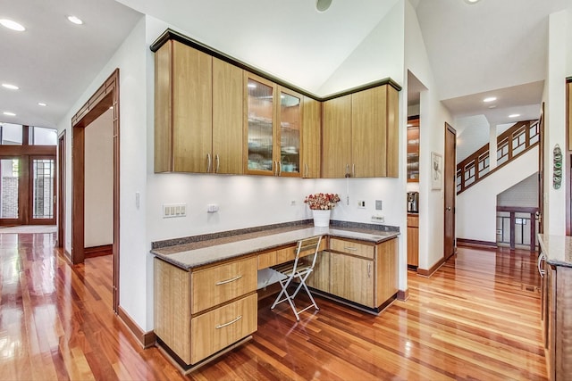 132 N Wynstone Dr, North Barrington, IL 60010 - kitchen featuring light wood finished floors, glass insert cabinets, baseboards, lofted ceiling, and recessed lighting