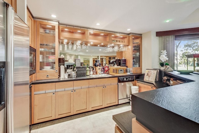 kitchen with sink, stainless steel appliances, and light brown cabinets