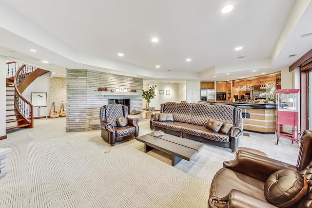 132 N Wynstone Dr, North Barrington, IL 60010 - living room with light colored carpet, stairway, recessed lighting, a tray ceiling, and a brick fireplace