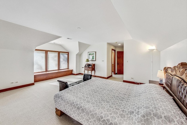 carpeted bedroom featuring vaulted ceiling