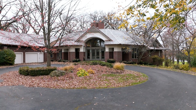 view of front of property with a garage