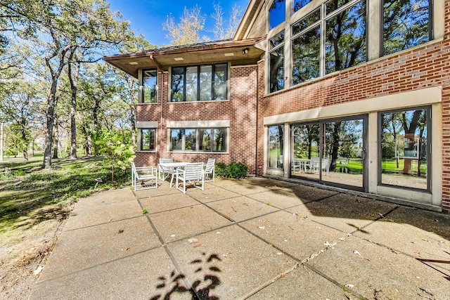 132 N Wynstone Dr, North Barrington, IL 60010 - rear view of house with brick siding and a patio area