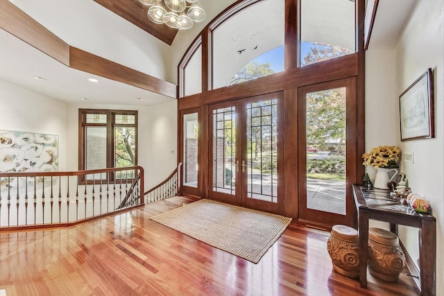 132 N Wynstone Dr, North Barrington, IL 60010 - entryway featuring french doors, wood finished floors, a chandelier, and lofted ceiling