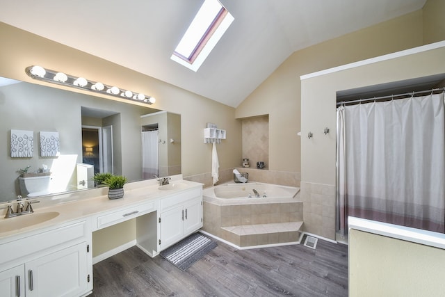 bathroom with vanity, lofted ceiling, separate shower and tub, and wood-type flooring