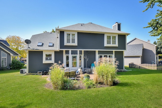 back of house featuring a patio area, cooling unit, and a lawn