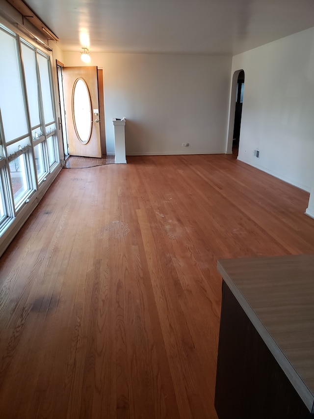 unfurnished living room with light hardwood / wood-style floors