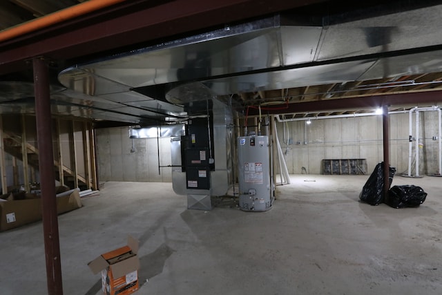 basement with water heater and heating unit