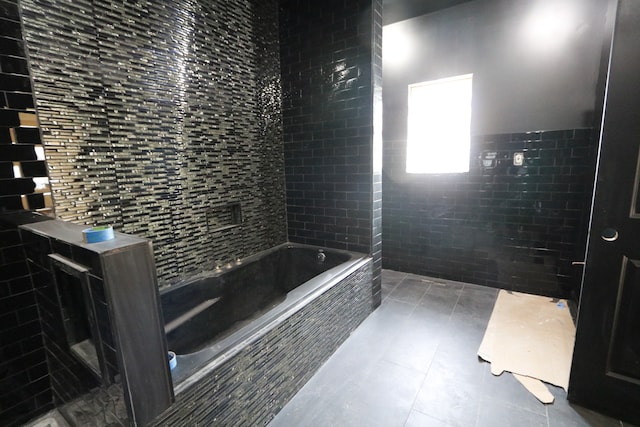 bathroom with tile walls