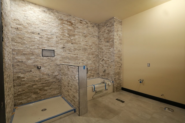 bathroom featuring shower with separate bathtub