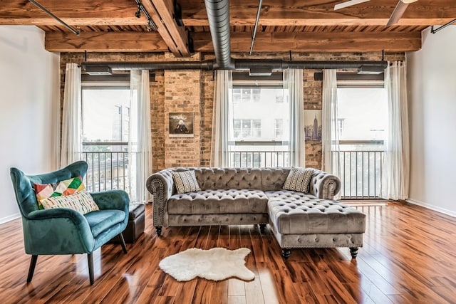 living room with beamed ceiling, hardwood / wood-style flooring, and wooden ceiling