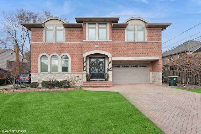 view of front of property with a garage, a front yard, and french doors