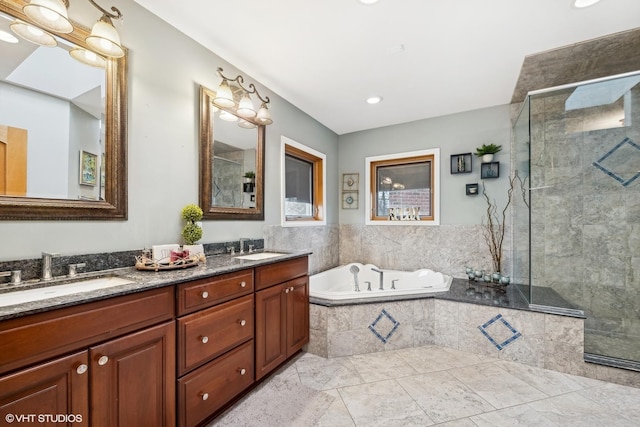 bathroom featuring separate shower and tub and vanity