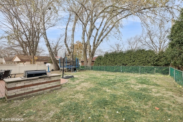 view of yard with a trampoline