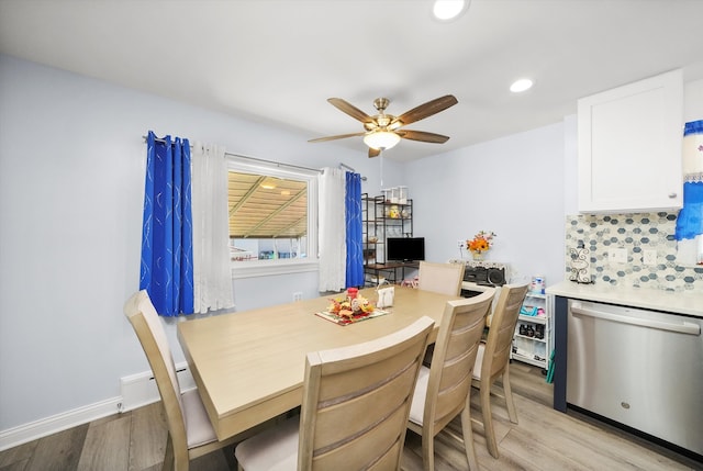 dining area with light wood-type flooring and ceiling fan