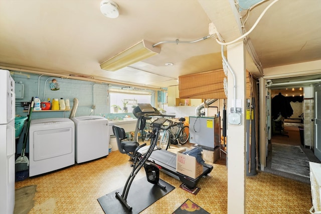 workout area with washer and clothes dryer