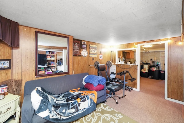 bedroom featuring wood walls and carpet