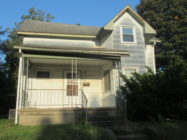 view of front facade with a garage and a porch