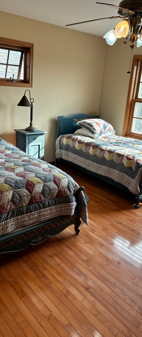 bedroom featuring light wood-type flooring and ceiling fan