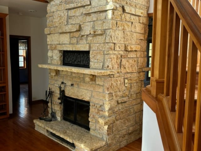 unfurnished living room with a fireplace and dark hardwood / wood-style flooring