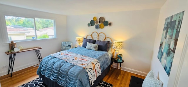 bedroom featuring dark hardwood / wood-style floors