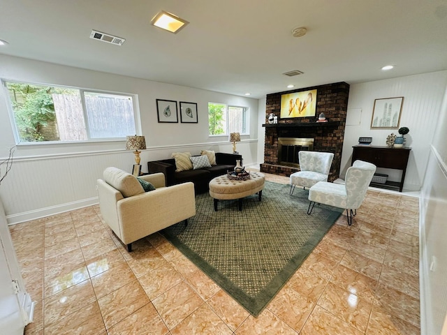 living room featuring a fireplace